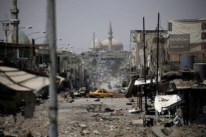 A view of a part of western Mosul, Iraq, May 29, 2017. Alkis Konstantinidis: "It was the second day of my assignment in Mosul and we were driving to join the Iraqi Federal Police forces at their frontline positions. The closer we got to our destination, the more obvious was the impact of the constant warfare. The cityscape was apocalyptic: demolished buildings, burnt cars tipped onto their sides, twisted masses of steel. We reached the frontline on what seemed a quiet day. But even if things appear calm, you have to be on alert about your surroundings. While moving fast from position to position, taking cover behind debris, I noticed a yellow car lying destroyed in the middle of the road ahead of us. I took a few wide-angle shots, which worked best as I was able to get the perspective of the street and the sweeping scale of the destruction.ÊNot a single element of my frame was untouched by the battle. Later that day, I tried to imagine what this street - whose name I couldn't find out as no signs were left standing - would have looked like on a "normal" day some years ago.ÊIt appeared to be a market street; people would have crossed it in a hurry, darting between traffic. The mosque in the background would have called the faithful to prayer and it would have been full of different noises: car honks, shop-owners shouting to attract customers, music playing in coffee shops full of people. These everyday sounds had now been replaced by the heavy crump of mortars, artillery, helicoptersÊand the clatter of gun battles. And the memory of a normal day seemed so distant." REUTERS/Alkis Konstantinidis/File photo        SEARCH "MOSUL PICTURES" FOR THIS STORY. SEARCH "WIDER IMAGE" FOR ALL STORIES.