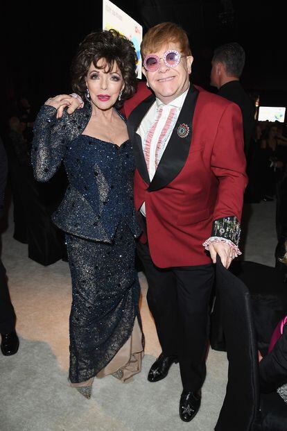 Joan Collins y Elton John.