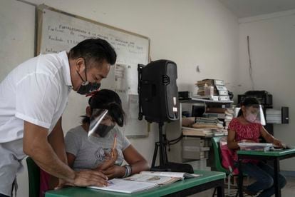 A teacher teaches at an elementary school in the Mexican state of Campeche last year.