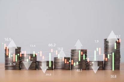 Virtual Up and down arrow and stock market graph with money coins stacking , Business investment profit and deposit dividend saving growth concept.