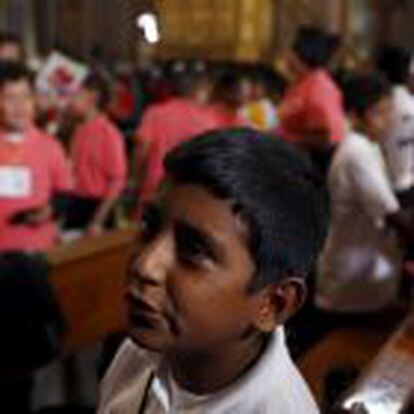 A boy is overcome with emotion after greeting Pope Francis at the cathedral in Morelia