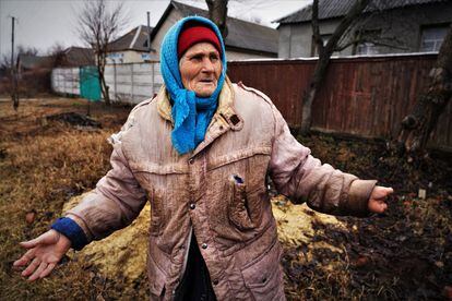 Lidia, 86, a neighbor of Kozacha Lopan who lost her left hand due to a work accident when she was 22, photographed on March 16.