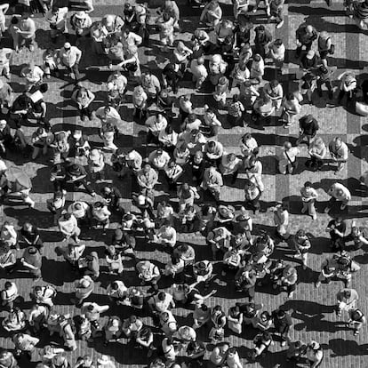 Crowd of people in the square in center of the town.