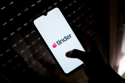 A person opens the Tinder app on their phone.  According to an internal Badoo study, its millennial users spent an average of 90 minutes a day on its app.
