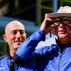 Billionaire American businessman Jeff Bezos wears goggles owned by Amelia Earhart which he carried into space at a post-launch press conference after he flew on Blue Origin's inaugural flight to the edge of space, in the nearby town of Van Horn, Texas, U.S., July 20, 2021. Bezos' brother Mark is on the left. REUTERS/Joe Skipper