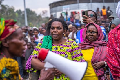 Josephine Malimukono, director of the NGO Ligue pour la Solidarité Congolaise (League for Congolese Solidarity), with a loudspeaker in her hand, in the Kanyaruchinya countryside, during an event to promote human rights and raise awareness of gender violence.