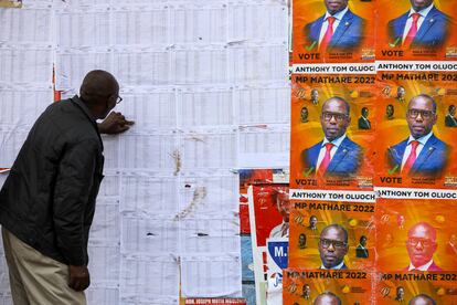 A Kenyan checks electoral lists Monday at a Nairobi polling station.