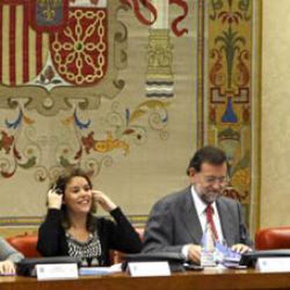 El líder del PP, Mariano Rajoy, y la portavoz parlamentaria, Soraya Sáenz de Santamaría.
