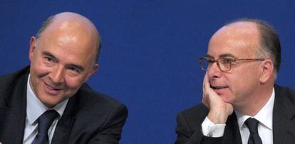 Moscovici y el ministro de Presupuestos, Cazeneuve.