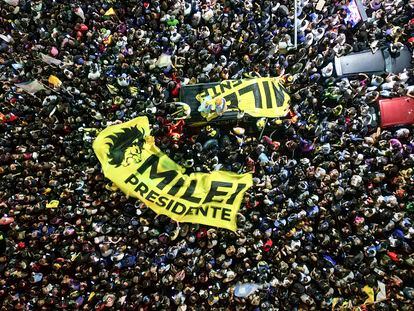 Supporters of presidential candidate Javier Milei gather outside his campaign headquarter after Economy Minister Sergio Massa, candidate of the Peronist party, conceded defeat in the presidential runoff election in Buenos Aires, Argentina, Sunday, Nov. 19, 2023. (AP Photo/Matias Delacroix)