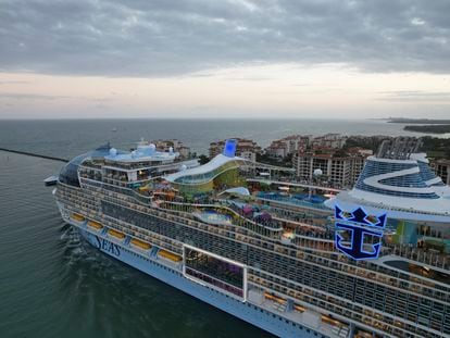 Icon of the Seas, the world's largest cruise ship, sails out of Government Cut past Fisher Island, Fla., right, as it departs PortMiami on its first public cruise, Saturday, Jan. 27, 2024. (AP Photo/Rebecca Blackwell)