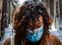 Naples (Italy), 30/03/2020.- A person wearing a protective face mask walks in one of the desertesd streets in the historic center of Naples, southern Italy, 30 March 2020. The mayor of Naples, Luigi de Magistris, said that the Municipality has a 'piggy bank' of around 10 million euros with which to deal with the emergency coronavirus by distributing grocery vouchers or basic necessities to those in need. Italy is under a complete lockdown in an attempt to stop the widespread of the SARS-CoV-2 coronavirus which causes the COVID-19 disease. (Italia, Nápoles) EFE/EPA/CESARE ABBATE
