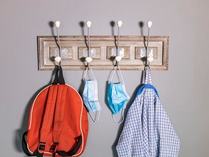 Coat rack of a school boy in a new normality
