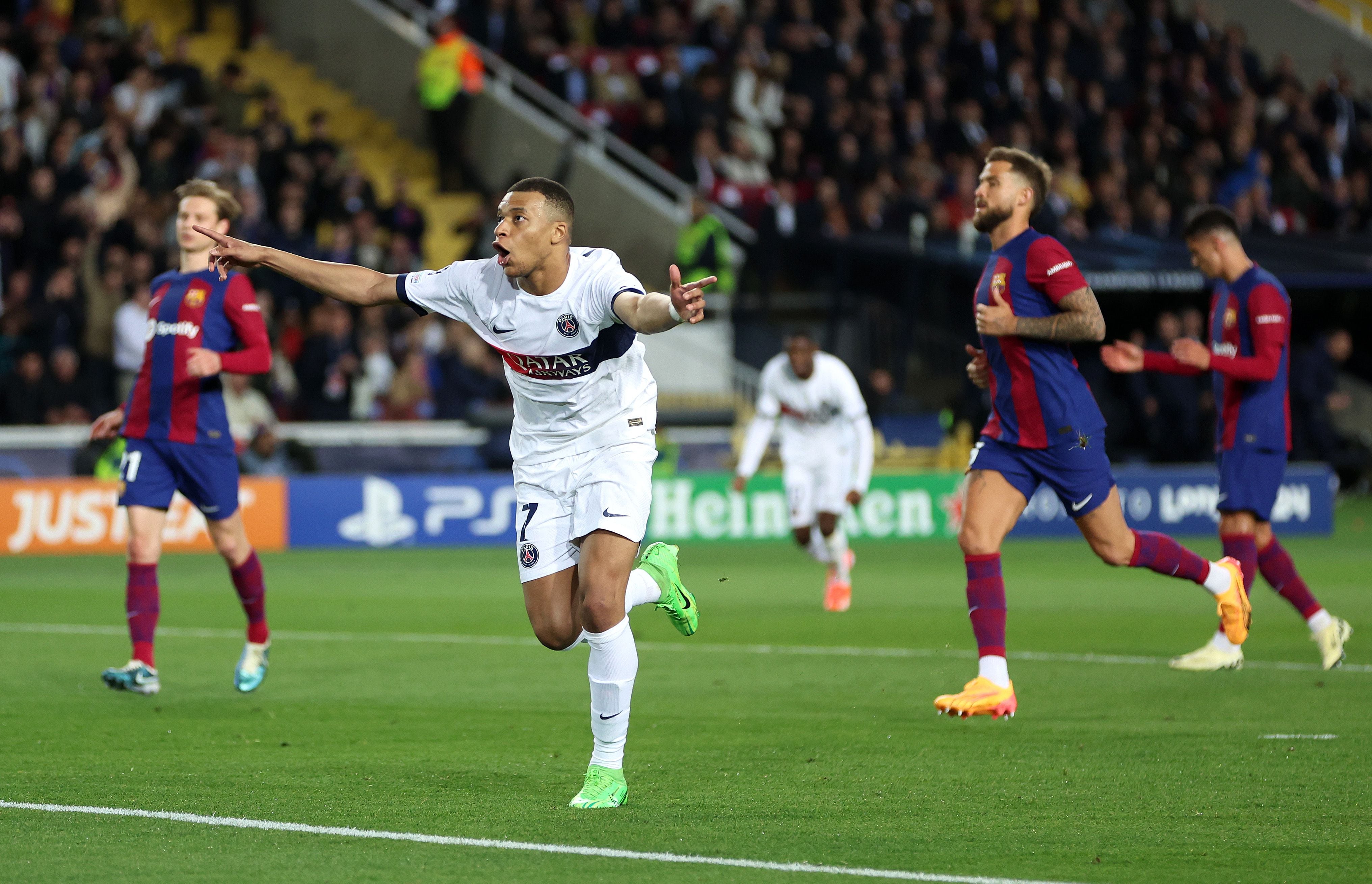 BARCELONA, SPAIN - APRIL 16: Kylian Mbappe of Paris Saint-Germain celebrates scoring his team's third goal from a penalty kick during the UEFA Champions League quarter-final second leg match between FC Barcelona and Paris Saint-Germain at Estadi Olimpic Lluis Companys on April 16, 2024 in Barcelona, Spain. (Photo by Clive Brunskill/Getty Images)