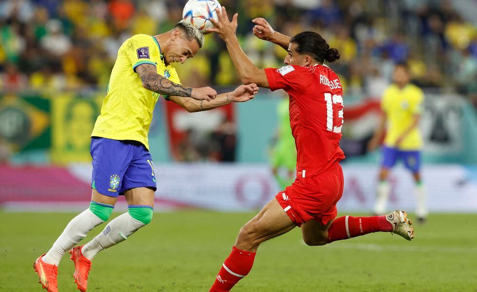 Soccer Football - FIFA World Cup Qatar 2022 - Group G - Brazil v Switzerland - Stadium 974, Doha, Qatar - November 28, 2022 Brazil's Antony in action with Switzerland's Ricardo Rodriguez REUTERS/Amanda Perobelli