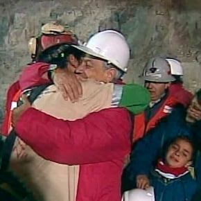 In this screen grab taken from video, Florencio Avalos, the first miner to be rescued, left, is embraced by Chilean President Sebastian Pinera after his rescue Tuesday, Oct. 12, 2010 at San Jose Mine near Copiapo, Chile. (AP Photo)
