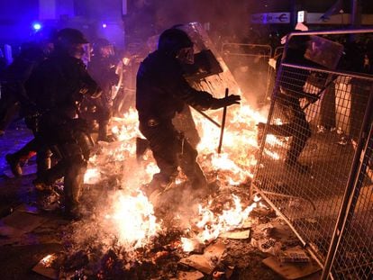 Riot police and protesters clashed in Barcelona on Tuesday night.