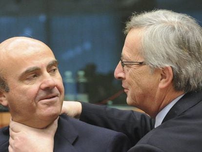 Luis de Guindos y Jean-Claude Juncker.
