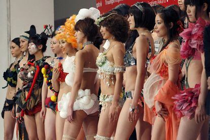 Models display lingerie designs as they pose at the Triumph Inspiration Award Japan lingerie design competition in Tokyo