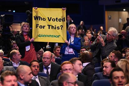 Two Greenpeace activists break into Prime Minister Liz Truss' speech in Birmingham on Wednesday.