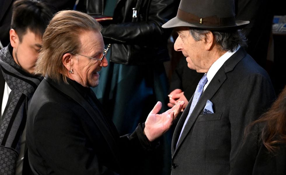 Irish singer-songwriter Bono (L) speaks to Paul Pelosi, husband of US Representative Nancy Pelosi (D-CA) prior to US President Joe Biden's State of the Union address in the House Chamber of the US Capitol in Washington, DC, on February 7, 2023. (Photo by SAUL LOEB / AFP)