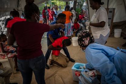 A young man with symptoms of cholera is treated at a clinic in Port-au-Prince, Haiti. 