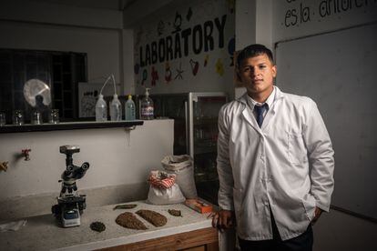 Jaider Andrés Narváez, a student at the Montessori school, poses in one of the school's laboratories.