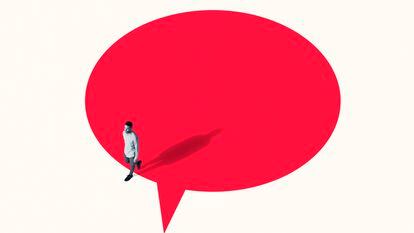 High angle view of young man walking out from vibrant red speech bubble against white background