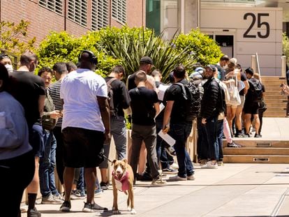 People stand in long lines to receive the monkeypox vaccine at San Francisco General Hospital in San Francisco, Tuesday, July 12, 2022. (Jessica Christian/San Francisco Chronicle via AP)