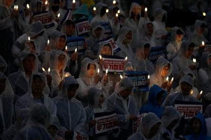 Members and supporters of South Korea's main opposition Democratic Party hold electronic candles during a rally to demand the withdrawal of the Japanese government's decision to release treated radioactive water into the sea, Wednesday in Seoul. 
