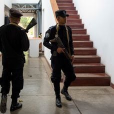 In this Dec. 14, 2018 photo, National Police officers walk inside office of the independent media outlet Confidencial, in Managua, Nicaragua. “All Nicaraguans are vulnerable to the possibility that they fabricate charges from the laws they (the government) invented,” the founder of Confidencial, Carlos Fernando Chamorro says. “No one is safe here. The law protects no one because in Nicaragua there is not rule of law.” (AP Photo/Alfredo Zuniga)