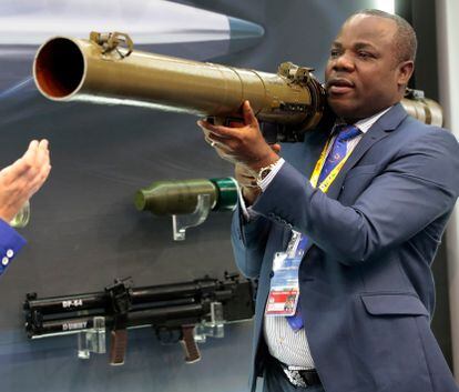 FILE - A visitor handles a Russian rocket-propelled grenade launcher RPG-29 at an exhibition of weaponry on the sidelines of the Russia-Africa summit in the Black Sea resort of Sochi, Russia on Oct. 24, 2019. Amid a worldwide chorus of condemnation against Russia's war on Ukraine, Africa has remained mostly quiet — a reminder of the Kremlin's considerable influence over the continent. (Sergei Chirikov, Pool Photo via AP, File)