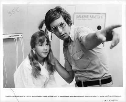 Linda Blair listens to instructions from director William Friedkin during the tense filming of 'The Exorcist'