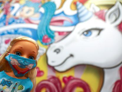 A Nancy doll, one of Spain's most beloved toys, is seen wearing a protective face mask at the headquarters of Spanish toy maker Famosa, in Madrid, Spain, November 30, 2020. Picture taken November 30, 2020. REUTERS/Sergio Perez