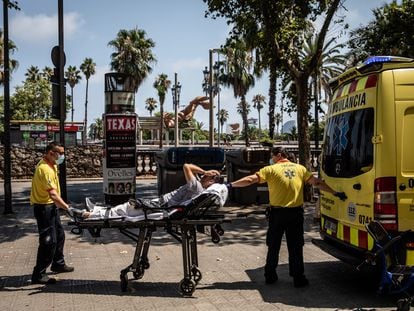 Paramedics help a patient into an ambulance during a heat wave in Barcelona, Spain, on Monday, July 18, 2022. The heat wave killed 360 people dead in Spain between July 10 and 15, Instituto de Salud Carlos III said on Saturday. Photographer: Angel Garcia/Bloomberg