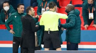 Soccer Football - Champions League - Group H - Paris St Germain v Istanbul Basaksehir F.K. - Parc des Princes, Paris, France - December 8, 2020 Referee Ovidiu Hategan with Istanbul Basaksehir coaching staff as the match is interrupted REUTERS/Charles Platiau