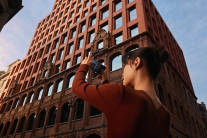 A user takes a photo with the OPPO Find X3 Pro 5G.