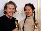 TOPSHOT - Producers Frances McDormand and Chloe Zhao, hold the Oscar for Best Picture for "Nomadland" as they pose in the press room at the Oscars on April 25, 2021, at Union Station in Los Angeles. - McDormand also won for Actress in a Leading Role for "Nomadland" and Chloe Zhao won Directing for "Nomadland" (Photo by Chris Pizzello / POOL / AFP)