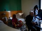 A nurse administers the Pfizer-BioNTech COVID-19 vaccine to a resident at the Icaria nursing home in Barcelona, Spain, Tuesday, Feb. 2, 2021. Spain's top coronavirus expert suggests that the coronavirus vaccine manufactured by AstraZeneca should be administered to young people given the lack of evidence on how it performs with older adults. (AP Photo/Emilio Morenatti)