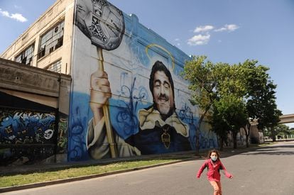 One of the murals about Maradona with the Boca Juniors coat of arms and colors.