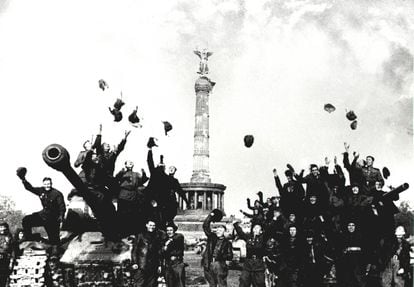 Soviet soldiers celebrate the end of World War II in Berlin on May 9, 1945, in a photo taken by Mark Redkin.