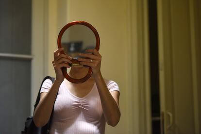 A woman tries on glasses from the Eyeglass Bank.