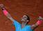 Spain's Rafael Nadal celebrates after winning against Serbia's Novak Djokovic at the end of their men's final tennis match at the Philippe Chatrier court on Day 15 of The Roland Garros 2020 French Open tennis tournament in Paris on October 11, 2020. (Photo by MARTIN BUREAU / AFP)