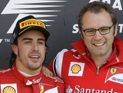 Alonso con el director de Ferrari, Domenicali.