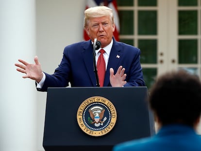 FILE - This March 29, 2020 file photo shows President Donald Trump answering a question from PBS reporter Yamiche Alcindor during a coronavirus task force briefing in the Rose Garden of the White House in Washington. Reporters Alcindor, Weijia Jiang and Kaitlan Collins have faced hostility from Trump at news conferences with stoicism. Their experiences illustrate the challenge of working at a White House with near-daily accessibility to a president who considers the press an enemy. (AP Photo/Patrick Semansky, FIle)