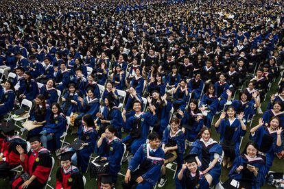 About 11,000 students attend their graduation ceremony at Central China Normal University in Wuhan.
