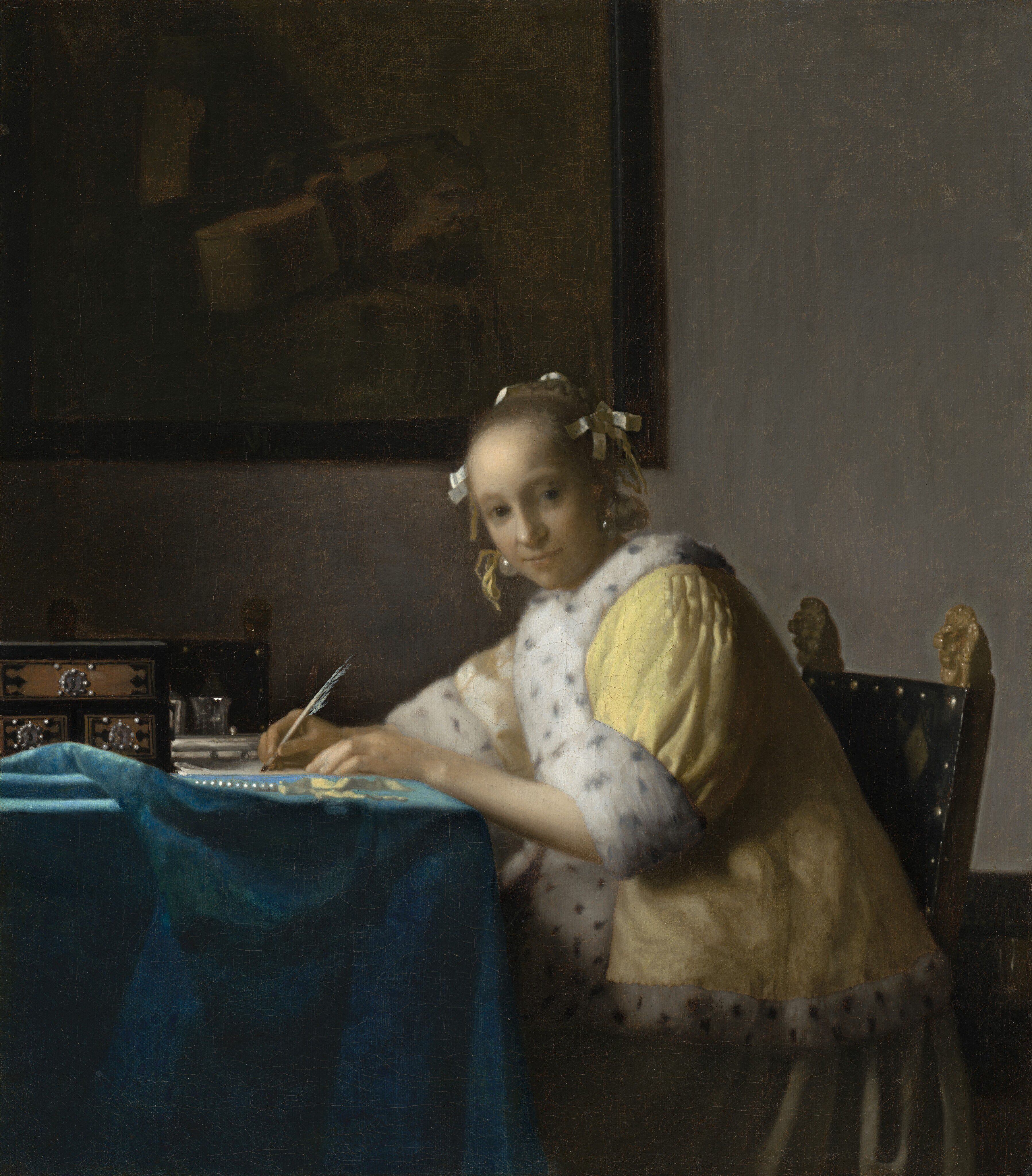 'Dama en amarillo escribiendo'.