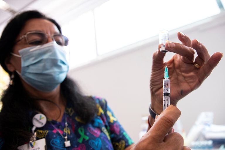 A nurse prepares a vaccine at the Chinese Sinovac laboratory at a health center in Santiago on February 12.