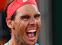 Spain's Rafael Nadal celebrates after winning against Serbia's Novak Djokovic at the end of their men's final tennis match at the Philippe Chatrier court on Day 15 of The Roland Garros 2020 French Open tennis tournament in Paris on October 11, 2020. (Photo by Anne-Christine POUJOULAT / AFP)