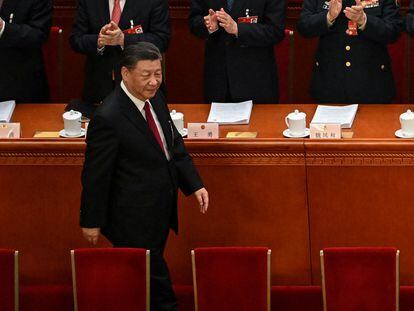 China's President Xi Jinping is applauded as he arrives for the opening session of the National People's Congress (NPC) at the Great Hall of the People in Beijing on March 5, 2023. (Photo by NOEL CELIS / AFP)